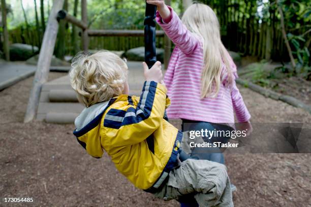 friends in playground - longleat house stockfoto's en -beelden