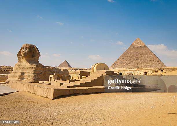 pyramids of giza with sphinx in foreground - sphinx stock pictures, royalty-free photos & images