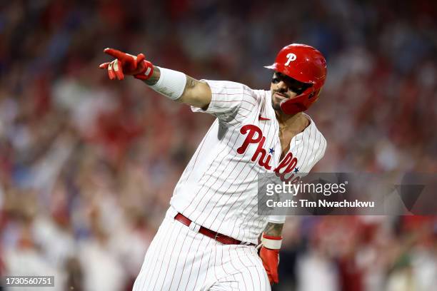 Nick Castellanos of the Philadelphia Phillies celebrates after hitting asolo home run against the Atlanta Braves during the eighth inning in Game...