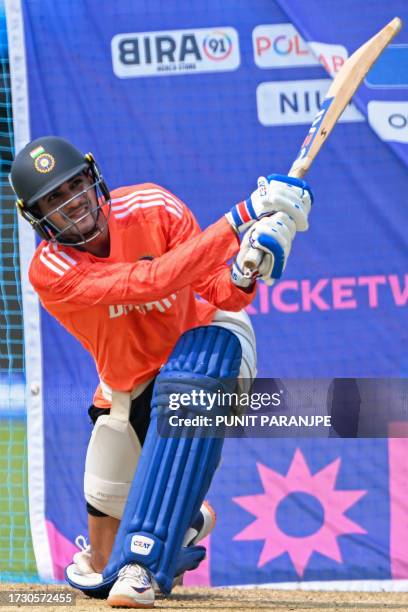 India's Shubman Gill plays a shot during a practice session on the eve of the 2023 ICC Men's Cricket World Cup one-day international match between...