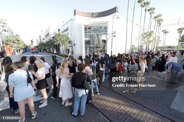 Fans are seen outside the world premiere of "Taylor Swift: The Eras Tour" concert movie at The Grove on October 11, 2023 in Los Angeles, California.