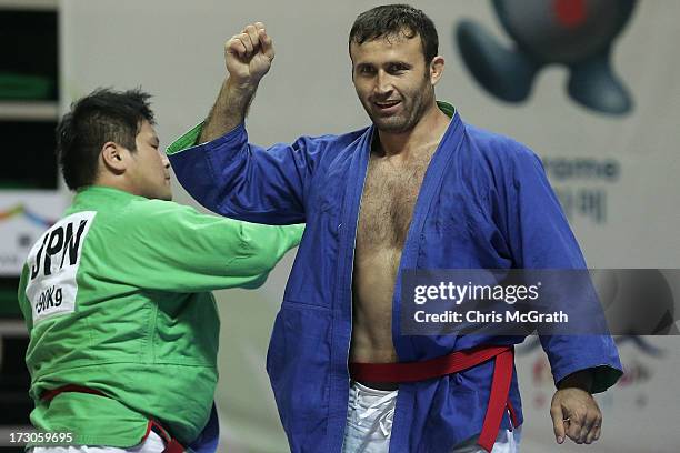 Sobirov Parviz of Tajikistan celebrates victory over Saeki Yuma of Japan during the Kurash Men's +90 kg Final at Ansan Sangnoksu Gymnasium on July 6,...