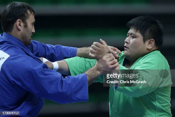 Sobirov Parviz of Tajikistan competes against Saeki Yuma of Japan during the Kurash Men's +90 kg Final at Ansan Sangnoksu Gymnasium on July 6, 2013...