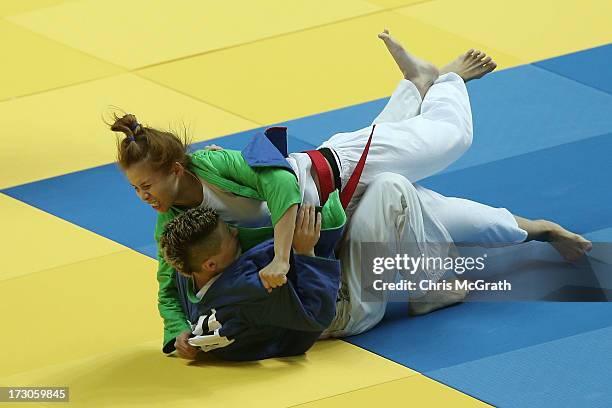 Su Bui Thi Hoa of Vietnam throws Mukhamedyanova Anzhelika of Kazakhstan during the Kurash Women's -63 kg Quarter-Final at Ansan Sangnoksu Gymnasium...