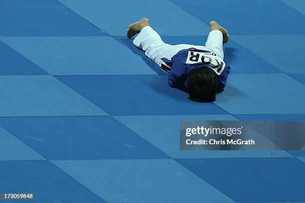 Su Choi Suyoung of Korea reacts after having a point scored against her by Chammas Caren of Lebanon during the Kurash Women's -63 kg Quarter-Final at...