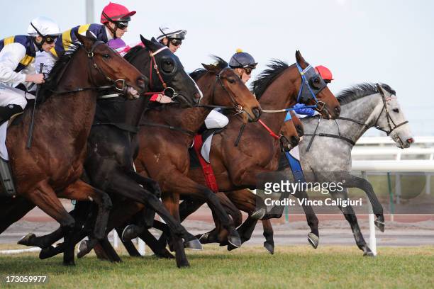 Horses jump out of the starting gates in the Banjo Paterson Series Final during Melbourne racing at Flemington Racecourse on July 6, 2013 in...