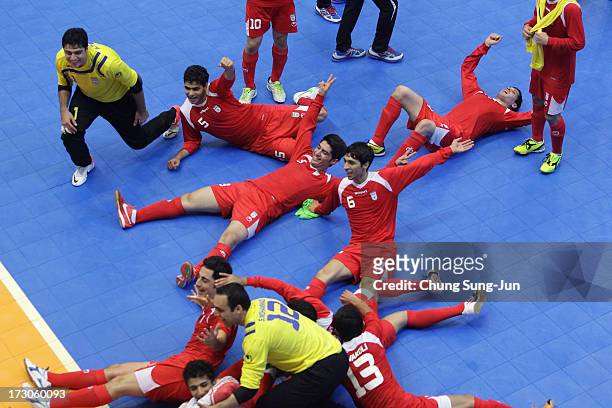 Iran players celebrate after winning against Japan during the Men's Futsal Gold Medal match at Songdo Global University Campus Gymnasium during day...