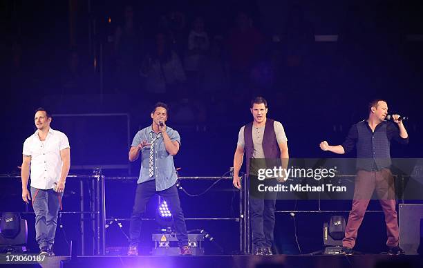 Drew Lachey, Jeff Timmons, Nick Lachey, Justin Jeffre of 98 Degrees performs onstage during "The Package Tour" held at Staples Center on July 5, 2013...