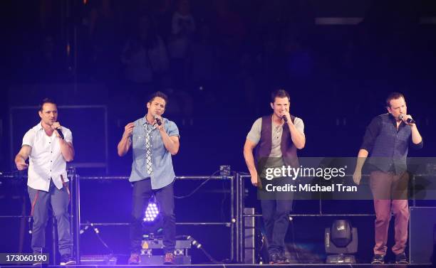 Drew Lachey, Jeff Timmons, Nick Lachey, Justin Jeffre of 98 Degrees performs onstage during "The Package Tour" held at Staples Center on July 5, 2013...