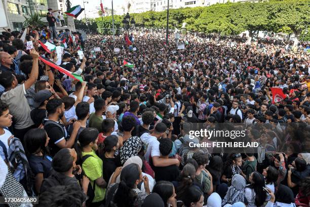 Protesters gather for an anti-Israel demonstration outside the French embassy headquarters along the Avenue Habib Bourguiba in the centre of Tunis on...