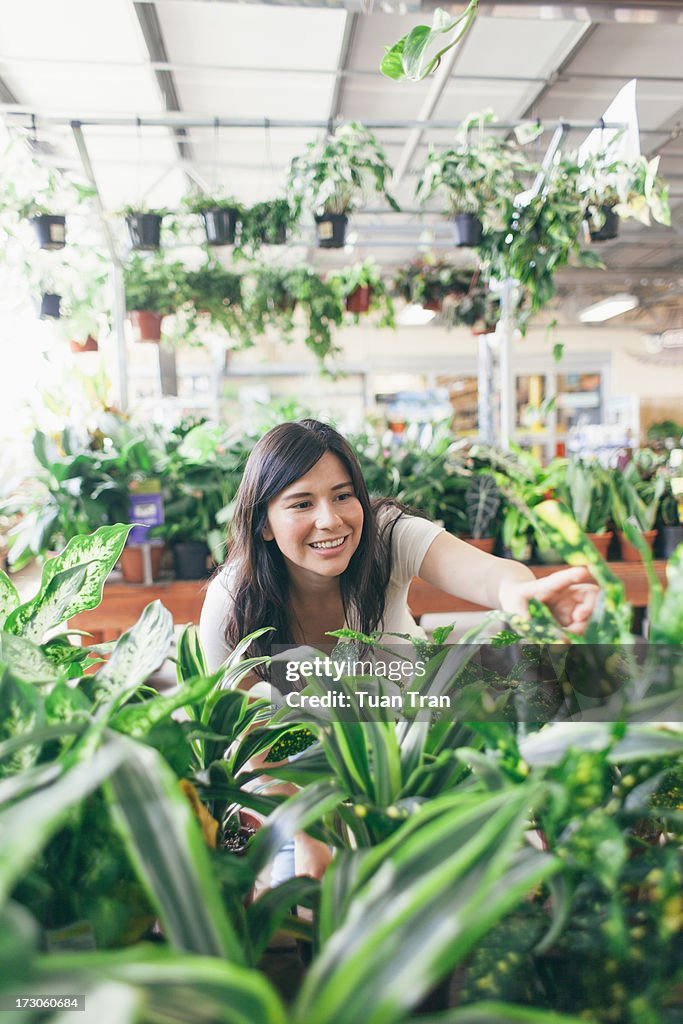 Woman looking at plants