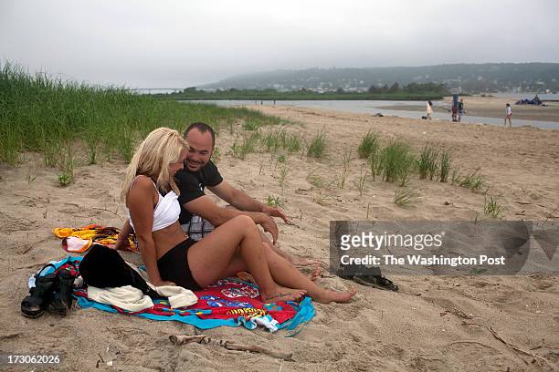Sandy Hook, NJ Stacey Spilatro from Morris Plains, NJ and Joe Hudack from Bridgewater, NJ, have a picnic on the beach at Sandy Hook, NJ on June 30,...