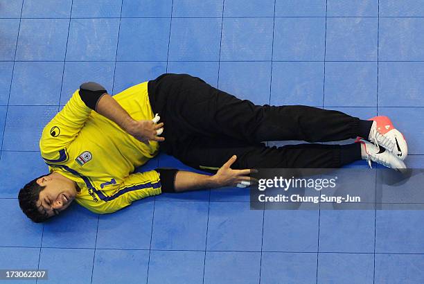 Alireza Samimi of Iran lies injured during the Men's Futsal Gold Medal match against Japan at Songdo Global University Campus Gymnasium during day...