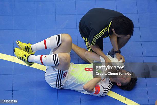 Manabu Takita of Japan lies injured during the Men's Futsal Gold Medal match against Iran at Songdo Global University Campus Gymnasium during day...