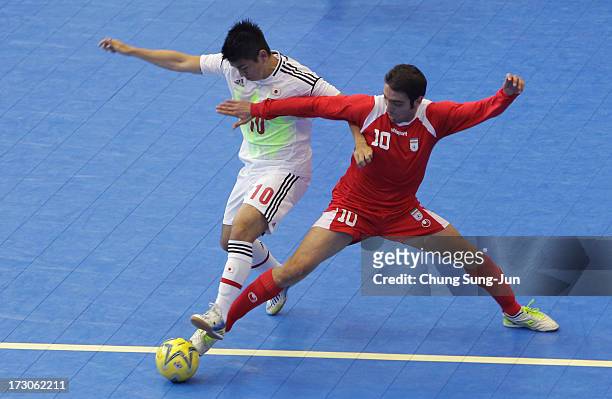 Mohammad Taheri of Iran competes for the ball with Katsutoshi Henmi of Japan during the Men's Futsal Gold Medal match at Songdo Global University...