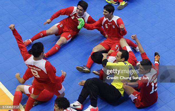 Iran players celebrate after winning against Japan during the Men's Futsal Gold Medal match at Songdo Global University Campus Gymnasium during day...