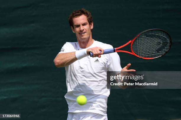 Andy Murray of Great Britain plays a forehand during a practice session on day twelve of the Wimbledon Lawn Tennis Championships at the All England...