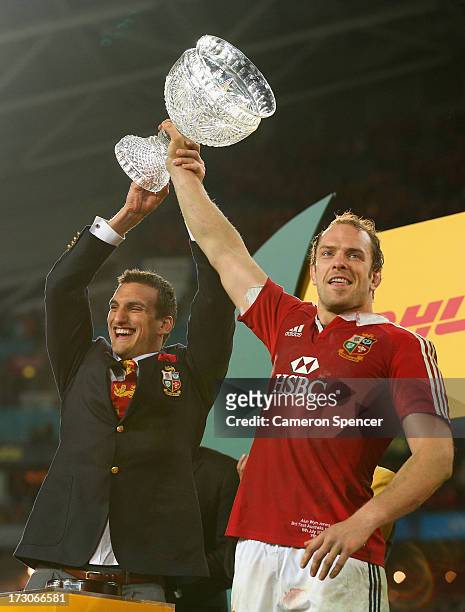 Injured Lions captain Sam Warburton and Lions captain Alun Wyn Jones hold the Tom Richards Cup aloft after the Lions victory in the International...