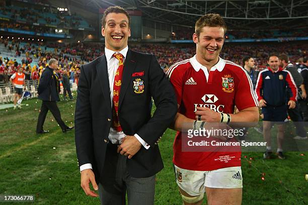 Injured Lions tour captain Sam Warburton and Dan Lydiate of the Lions share a laugh after winning the International Test match between the Australian...