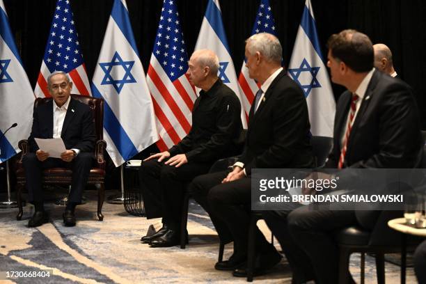Israel's Prime Minister Benjamin Netanyahu speaks during a meeting of the Israeli war cabinet, attended by the US President, in Tel Aviv on October...