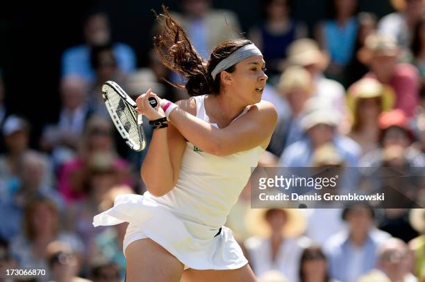 Marion Bartoli of France plays a backhand during the Ladies' Singles final match against Sabine Lisicki of Germany on day twelve of the Wimbledon...