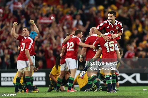 Conor Murray and Leigh Halfpenny of the Lions celebrate victory in the International Test match between the Australian Wallabies and British & Irish...