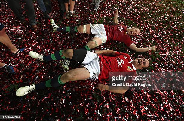 Alun Wyn Jones and Jamie Roberts of the Lions roll around in the confetti after their victory during the International Test match between the...