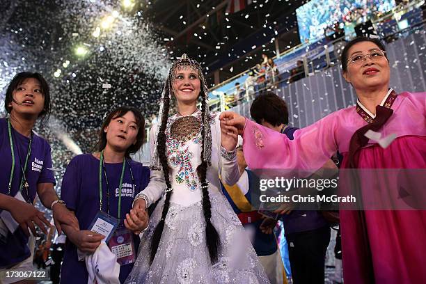 Performers, athletes and volunteers dance and celebrate at a concert during the closing ceremony of the 4th Asian Indoor & Martial Arts Games at...