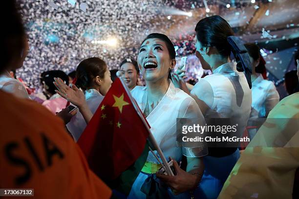Performers, athletes and volunteers dance and celebrate at a concert during the closing ceremony of the 4th Asian Indoor & Martial Arts Games at...