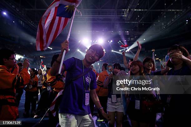 Performers, athletes and volunteers dance and celebrate at a concert during the closing ceremony of the 4th Asian Indoor & Martial Arts Games at...