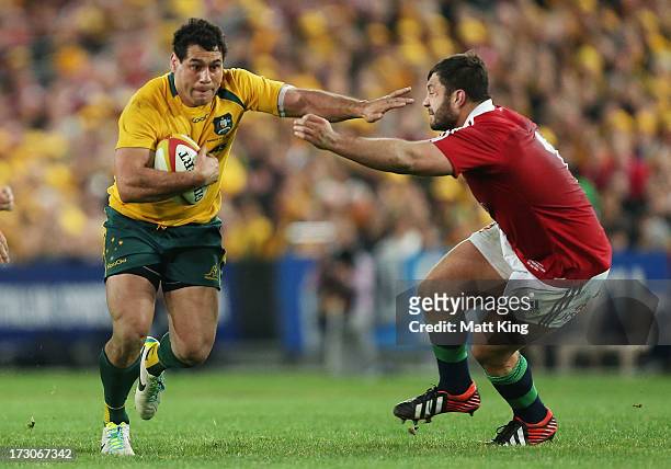 George Smith of the Wallabies takes on the defence during the International Test match between the Australian Wallabies and British & Irish Lions at...