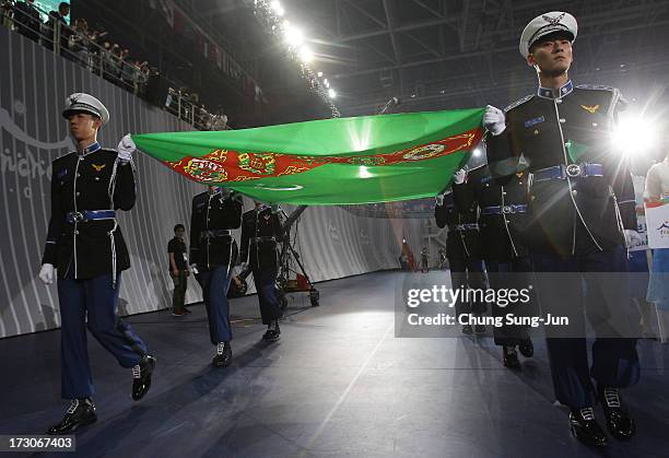 South Korean honor guards hold Turkmenistan flag, next host city of Asian Indoor & Martial Arts Games during closing ceremony of the 4th Asian Indoor...