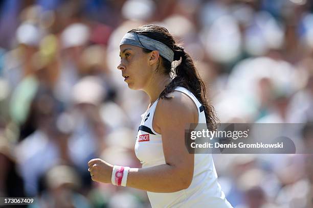 Marion Bartoli of France celebrates a point during the Ladies' Singles final match against Sabine Lisicki of Germany on day twelve of the Wimbledon...