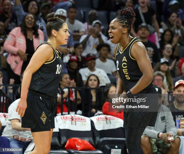Kelsey Plum and Chelsea Gray of the Las Vegas Aces react after Plum scored a basket and drew a foul against the New York Liberty in the first quarter...