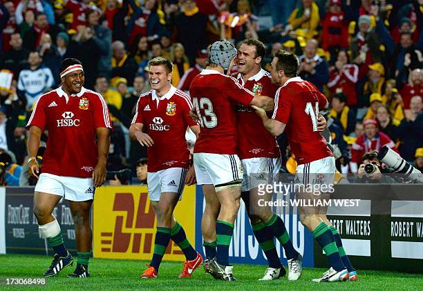 British and Irish Lions centre Jamie Roberts is congratulated by teammates after scoring against the Australian Wallabies in the third rugby Test...
