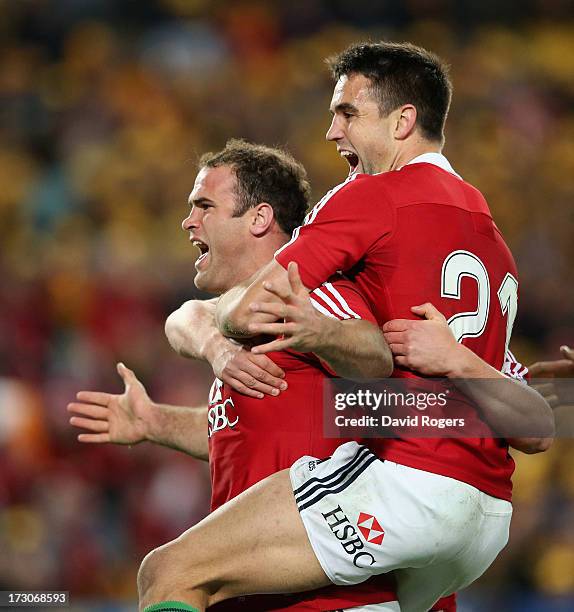 Jamie Roberts of the Lions is mobbed by team mates Conor Murrayafter scoring the Lions fourth try during the International Test match between the...