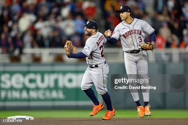 Jose Altuve and Jeremy Pena of the Houston Astros celebrate after defeating the Minnesota Twins in Game Four of the Division Series at Target Field...