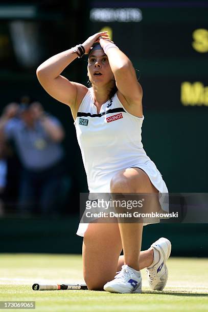 Marion Bartoli of France celebrates championship point during the Ladies' Singles final match against Sabine Lisicki of Germany on day twelve of the...