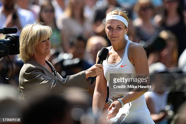 Sabine Lisicki of Germany cries during a post-match interview with Sue Barker on Centre Court after her Ladies' Singles final match against Marion...