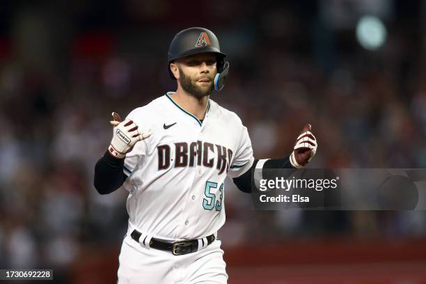 Christian Walker of the Arizona Diamondbacks celebrates while rounding the bases after hitting a home run in the third inning against the Los Angeles...