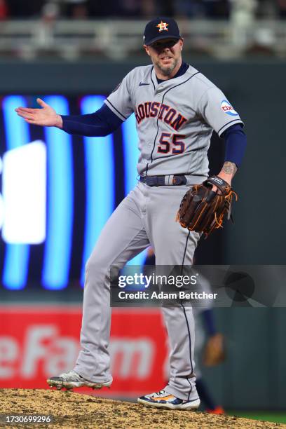 Ryan Pressly of the Houston Astros celebrates after striking out Max Kepler of the Minnesota Twins to end Game Four of the Division Series at Target...