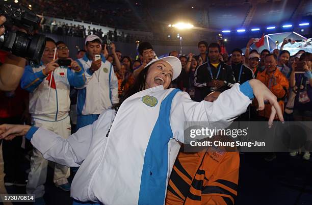 Athletes and volunteers dance and celebrate at a concert during during the closing ceremony of the 4th Asian Indoor & Martial Arts Games at Incheon...