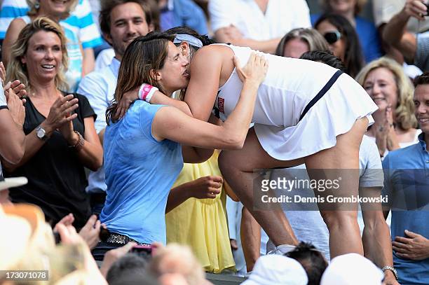 Marion Bartoli of France celebrates victory with her coach Amelie Mauresmo after the Ladies' Singles final match against Sabine Lisicki of Germany on...