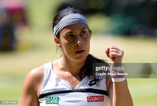 Marion Bartoli of France celebrates a point during the Ladies' Singles final match against Sabine Lisicki of Germany on day twelve of the Wimbledon...