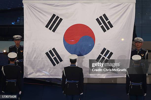 The Korean flag is raised to the roof during the closing ceremony of the 4th Asian Indoor & Martial Arts Games at Incheon Samsan World Gymansium on...