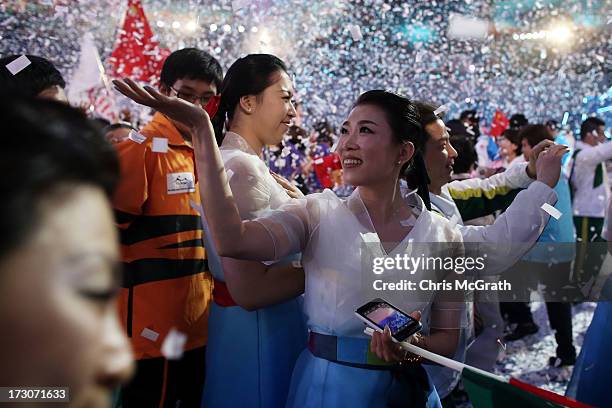 Performers, athletes and volunteers dance and celebrate at a concert during the closing ceremony of the 4th Asian Indoor & Martial Arts Games at...