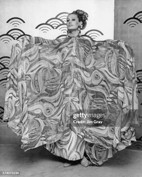 Model at the Japanese Silk Exhibition wears a kaftan and suit made of Japanese silk, Japan Trade Centre, Oxford Street, London, 21st February 1967.