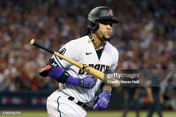 Ketel Marte of the Arizona Diamondbacks tosses his bat after hitting a home run in the third inning against the Los Angeles Dodgers during Game Three...