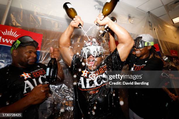 Framber Valdez of the Houston Astros celebrates with teammates after defeating the Minnesota Twins in Game Four of the Division Series at Target...