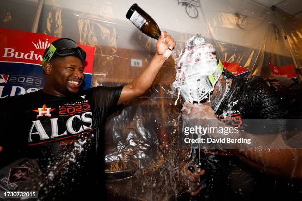Hector Neris and Framber Valdez of the Houston Astros celebrate after defeating the Minnesota Twins in Game Four of the Division Series at Target...